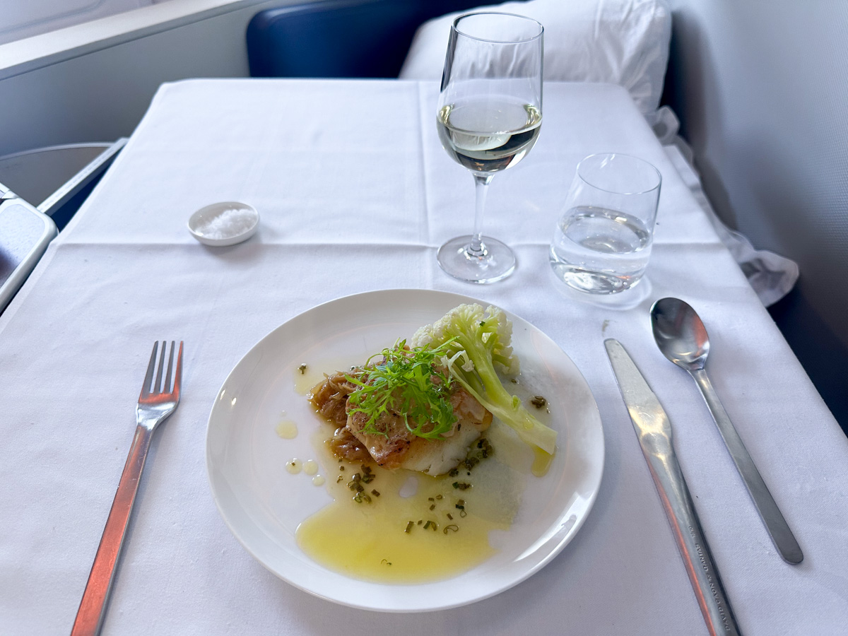 Seared Glacier 51 toothfish with miso butter braised cabbage, fioretto, sesame and yuzu in Qantas first class