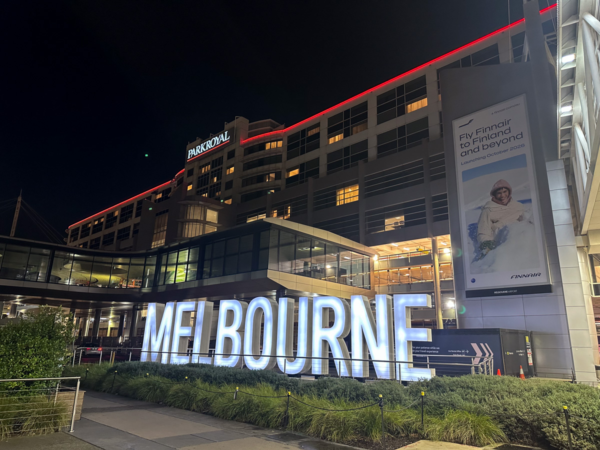 PARKROYAL Melbourne Airport hotel at night, with Finnair advertisement