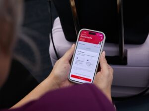 Person using Virgin Australia app to fly ahead