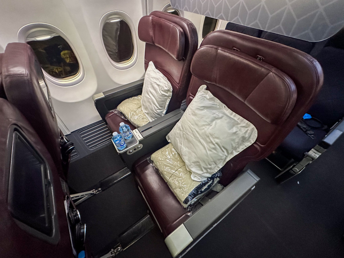 Qantas Boeing 737 Business Class seats with pillows and blankets placed on them