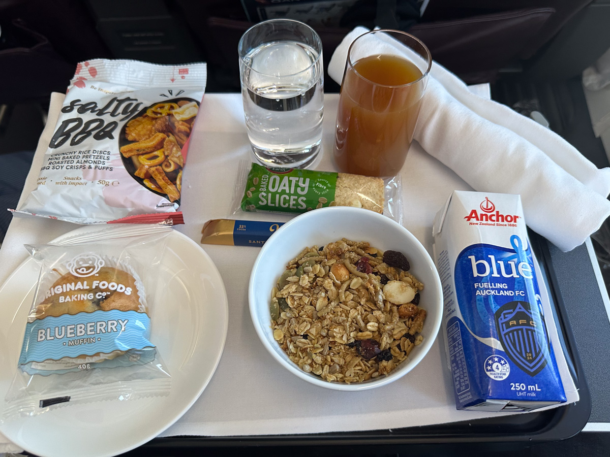 Qantas Business Class breakfast on QF144 with muesli, packaged snacks and long-life milk