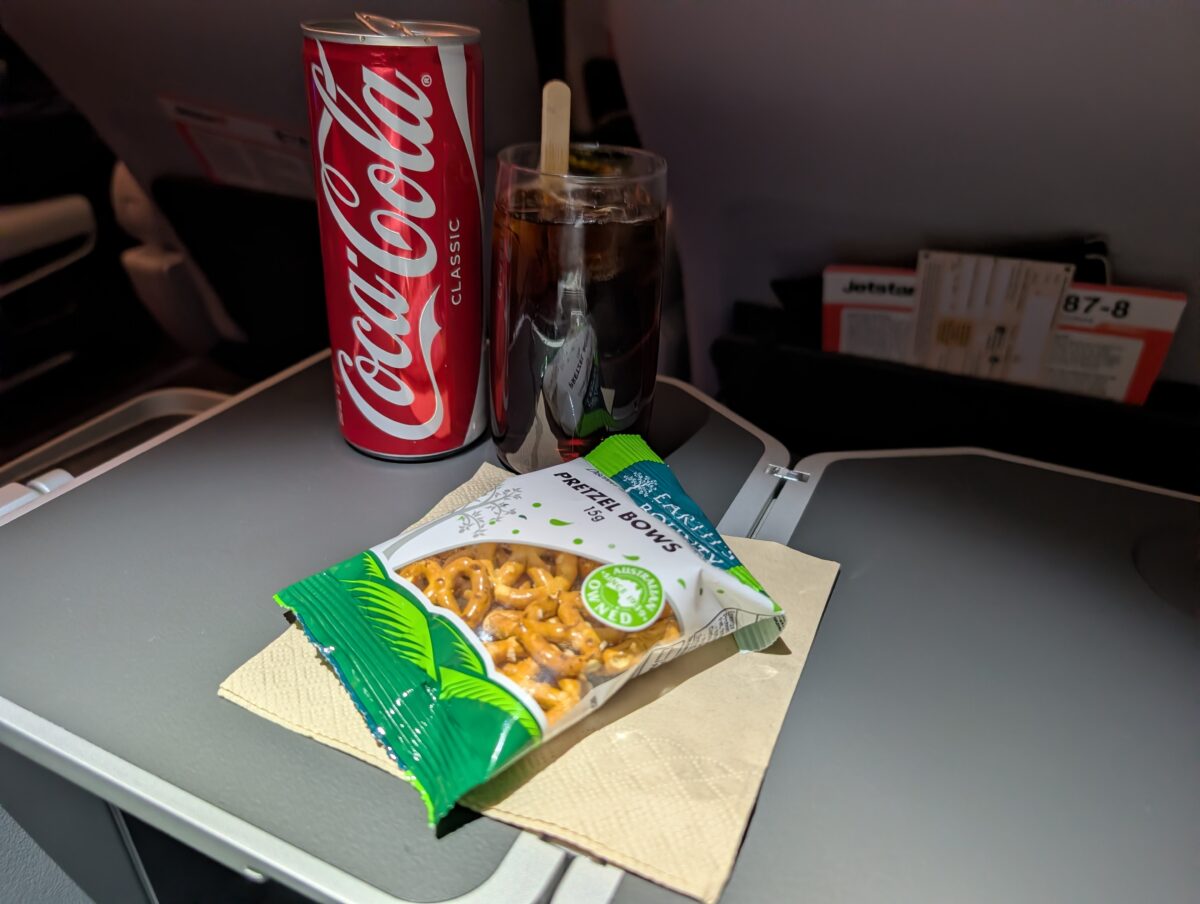 Pretzels and a drink served after departure on Jetstar