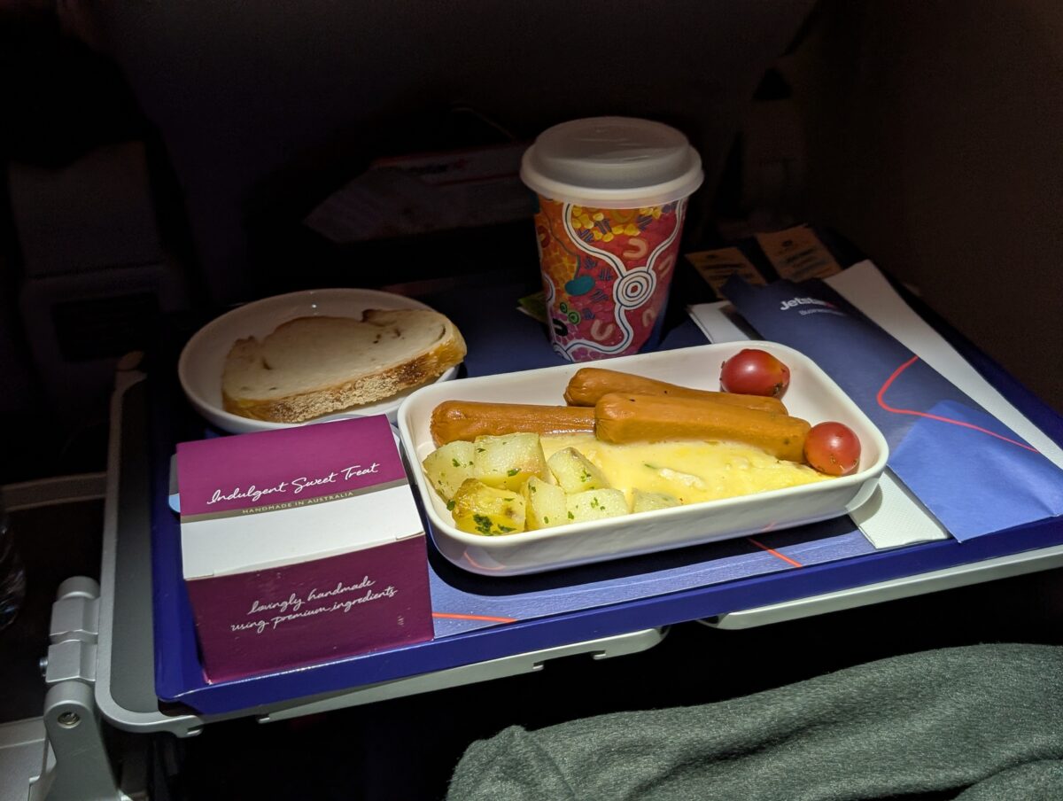Cheese omelette with chicken sausages served for breakfast on Jetstar