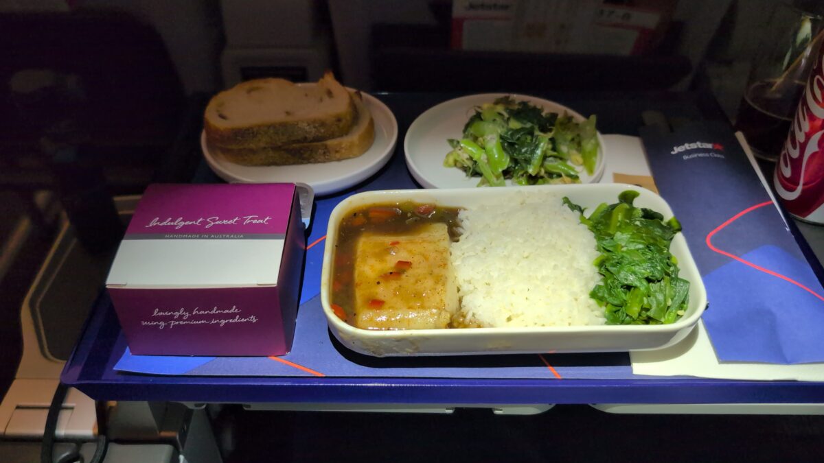 Steamed market fish with rice, sourdough and a side salad in Jetstar Business Class