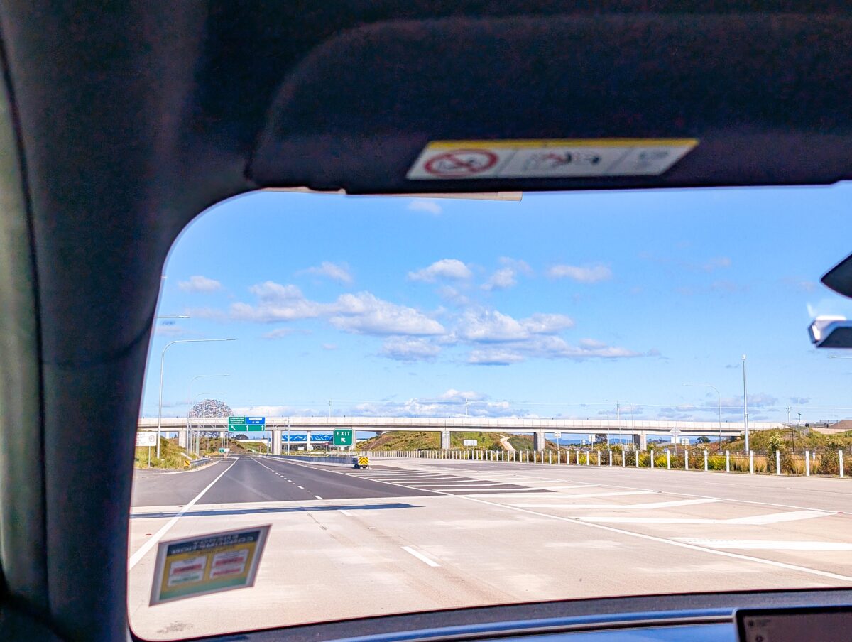 View through a car windscreen of the quiet M12 Motorway approaching Western Sydney International Airport